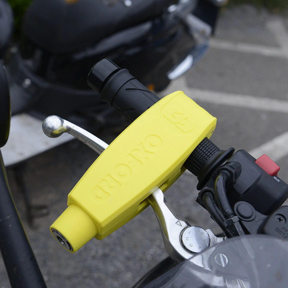 Zámek páčky přední brzdy motocyklu OXFORD LEVERLOCK LK301 barva žlutá, pro průměr gripů od 28 do 38 mm